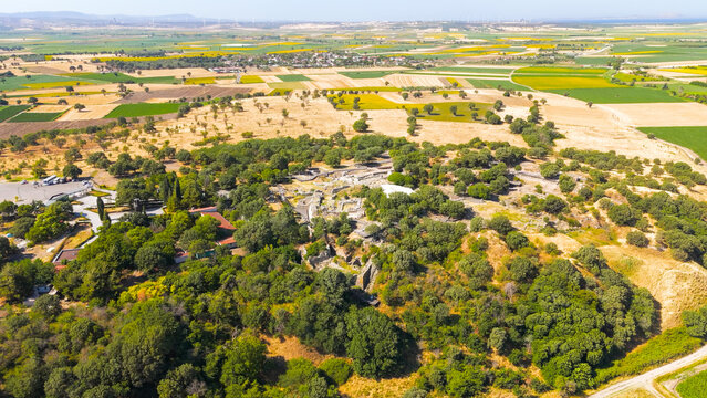 Tevfikiye, Turkey. The ancient city of Troy archaeological site and ruins surrounded by agricultural fields on a sunny summer day in Canakkale Province. Aerial view