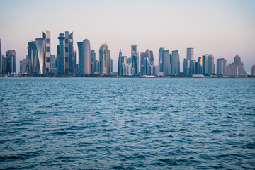 Obraz premium A wide shot of a modern city skyline from across the water.