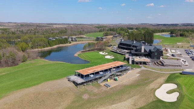 The TPC Toronto golf course features a modern clubhouse, lush fairways, and serene water hazards. Perfect for promotional materials or travel features.