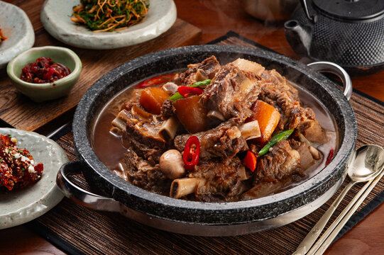 Korean Traditional Braised Beef Short Ribs Galbijjim in Hot Stone Pot with Vegetables