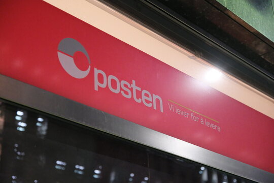 Oslo, Norway-Nov.25th 2025: red Posten Norwegian postal service signboard with logo