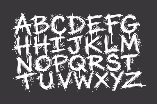White dripping graffiti alphabet letters A to Z with hashtags and scribbles on dark background unique font.