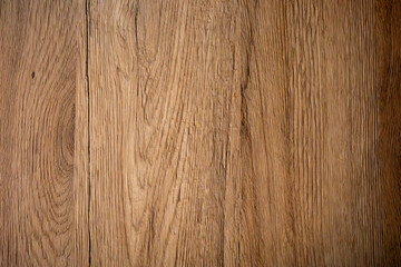 Obraz premium Wooden floor showing texture and grain patterns with warm tones during the daytime