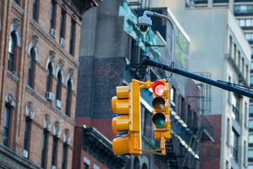 Red traffic light and security camera on city street © Cavan