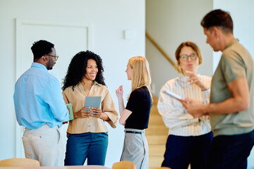 Diverse business colleagues networking and communicating during a casual meeting. Team members...