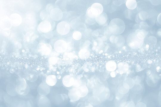 Soft blue sparkling bokeh background with airy light
