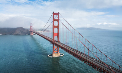 Fototapeta premium Foggy cityscape of San Francisco, California, near the Golden Gate Bridge.