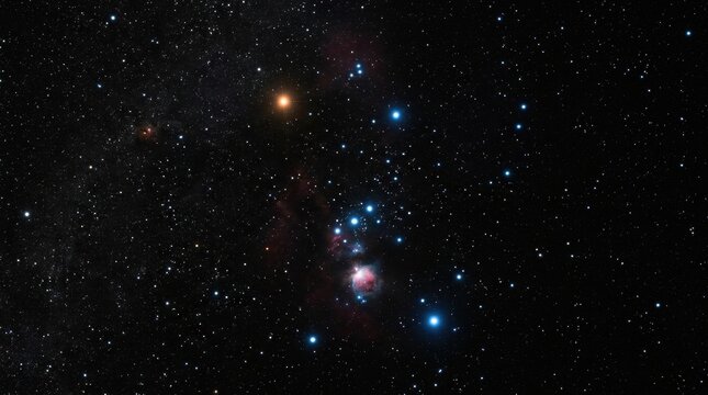 Wide field astrophotography of the Orion constellation showing the red supergiant Betelgeuse, the blue giant Rigel, Orion's Belt, and the Orion Nebula M42 in a starry sky.