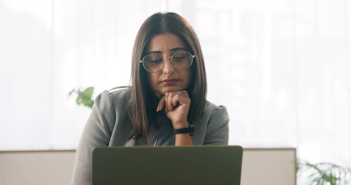 Tired, businesswoman and bored in office with laptop, glasses or burnout for paralegal administration. Law clerk, female person reading and fatigue in firm with computer, thinking or legal challenge.