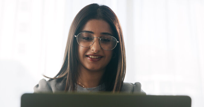 Happy, businesswoman and reading in office with laptop, paralegal admin or good news for court case. Law clerk, smile and person in firm with computer, dispute resolution or review lawsuit settlement