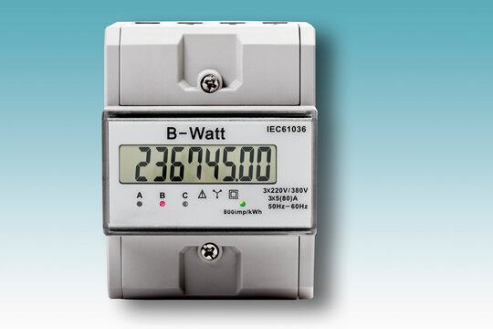 Digital electric meter against blue background