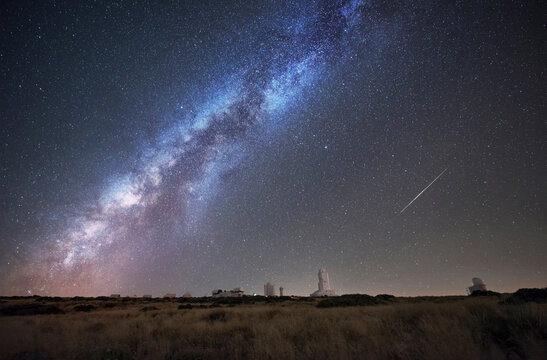 Spain, Tnerife, Milky way and perseid meteor, over Teide Izana astronomical observatory.