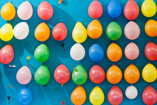 Germany, Bavaria, Munich, Multi coloured balloons and dart at oktoberfest