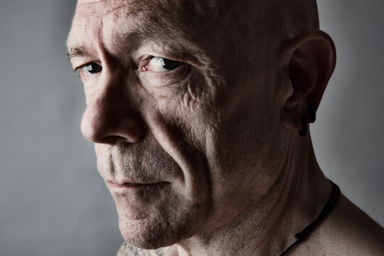 Portrait of sceptical looking man with bald
