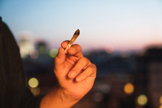 Young man smoking a joint