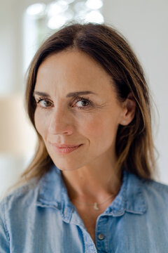 Portrait of confident mature brunette woman