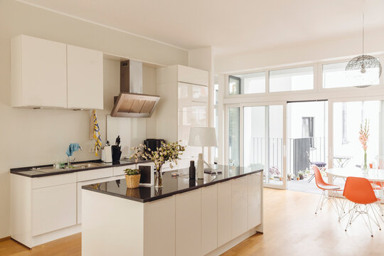 Kitchen with counter island and table in modern building