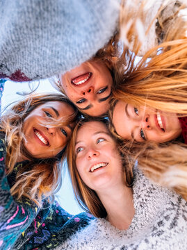 Portrait of four happy friends head to head