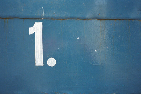 Number 1' painted on wall, close-up