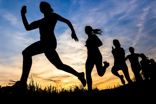 Silhouette of female jogger at sunset, sequence, phases