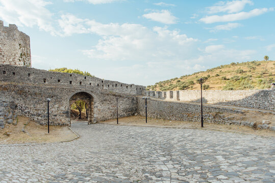Cobblestone entrance road and stone walls at Berat Castle in Albania