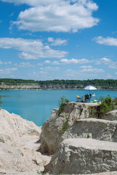 Chairs Umbrella Cliff Overlooking Turquoise Lake