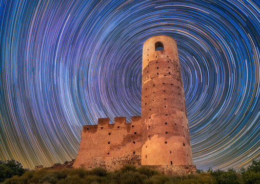 Dramatic Circumpolar Star Trails Over Historic Almonecir Castle Ruins