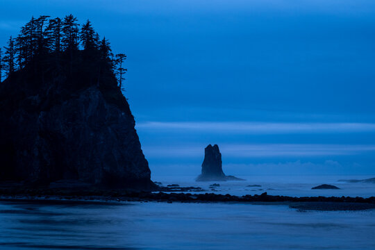 Rocky coastline and sea stacks at blue hour