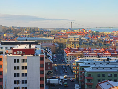High angle view of Gothenburg cityscape with buildings and streets, with the Alvsborg Bridge in the background, Sweden