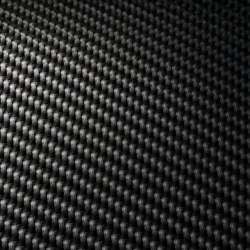 Texture carbone noir tress&eacute; sous lumi&egrave;re contrast&eacute;e