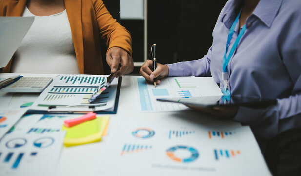 Auditor and accountant team working in office, analyze financial data and accounting record with calculator. Accounting company provide finance and taxation planning for profitable cash flow. Insight
