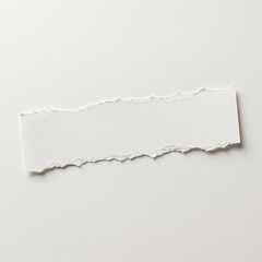 Fototapeta premium Minimalist blank white paper strip with distinctive rough, torn edges, providing an elegant, textured space for custom notes, announcements, or artistic typography in a clean setting