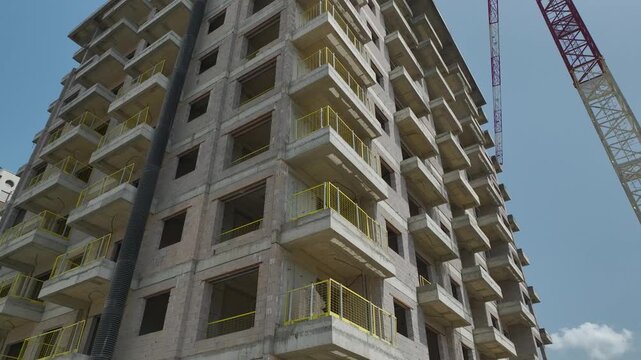 Aerial Video of city growth with crane and modern apartments in Alanya