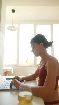 Young woman working from home during virtual business meeting