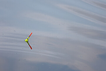 Fishing float bobber on a calm water surface © k49red