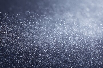 Fototapeta premium Sparkling bokeh effect with shimmering light particles on a dark background.