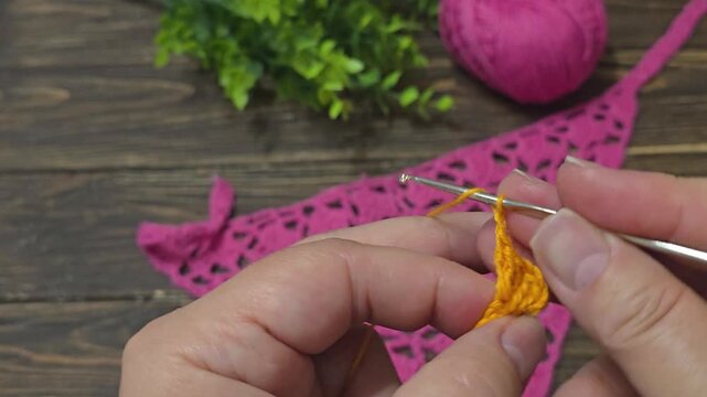 Knitting patterns with a raised pattern and yarn in different colors. Knitted texture. Space for text.