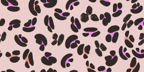 Fototapeta premium A seamless vector pattern of stylized leopard spots in black, purple and coral on soft pink background