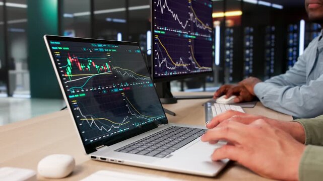 Trader And Analyst Discuss Stock Market Trends Using Computers