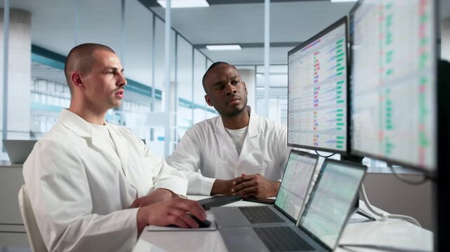 Doctor Reviews Medical Billing Codes On Computer