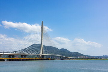Fototapeta premium Danjiang Bridge in Tamsui Taiwan with blue sky