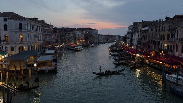 Slow Motion Gondola Gliding Through Venice Canal at Night