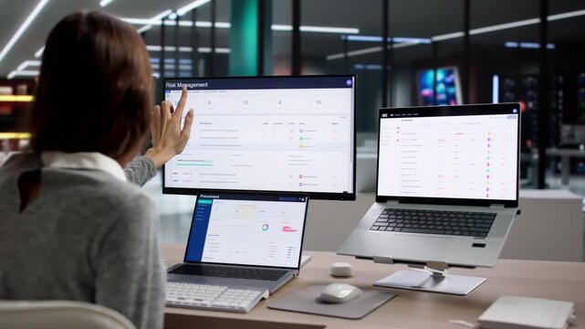Risk Manager Analyzing Corporate Data On Laptop