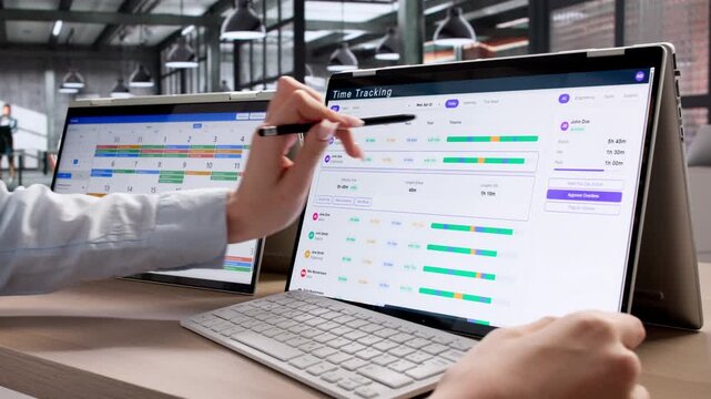 Project Manager Uses Digital Timesheet App On Hybrid Laptop