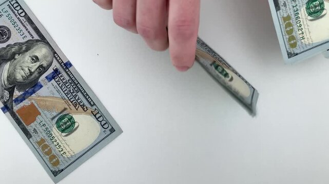 A woman counts banknotes. Analysis of income and financial capabilities of a business. The importance of profit, investment, and a competent approach to developing your own business