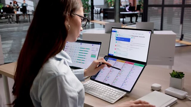 Agile Project Manager Reviews Kanban Board Tasks