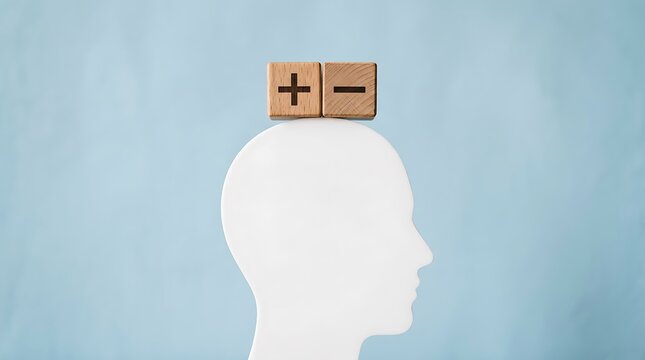 White silhouette head with plus and minus blocks