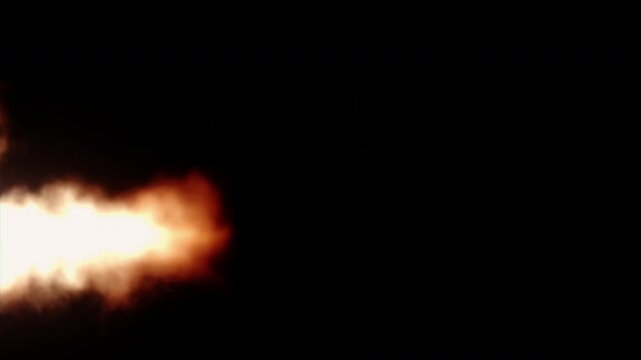 Realistic fire burst explosion with smoke moving across a black screen.