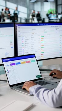 Sales Manager Reviewing Customer Data On Computer