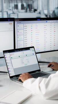 Healthcare Billing Manager Reviews Patient Claims On Laptop
